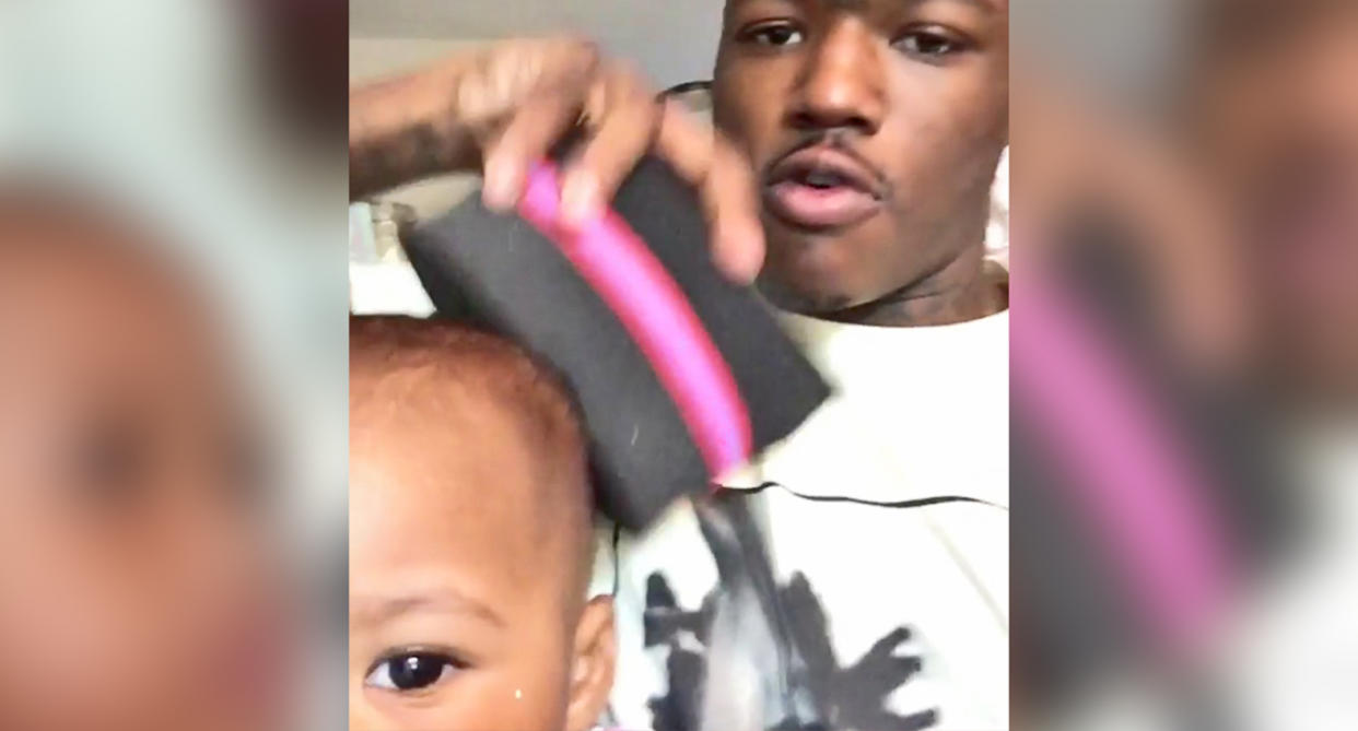 DC Young Fly attempted to curl his daughter's hair with a sponge brush, and it's hilarious. 