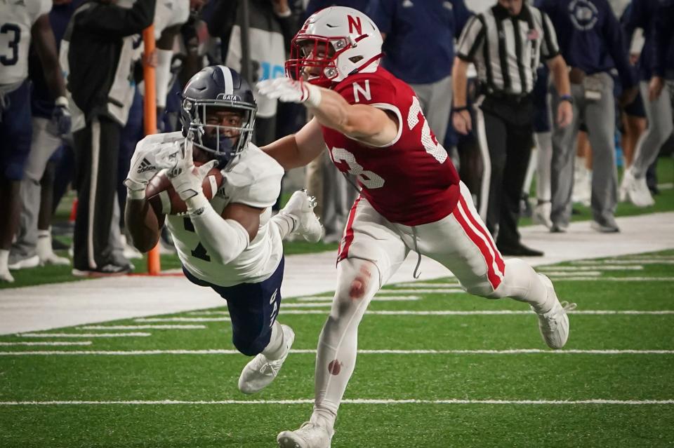 Georgia Southern receiver Khaleb Hood (7) extends to catch a pass in front of Nebraska defender Isaac Gifford (23) on Sept. 10, 2022, in Lincoln, Nebraska. Hood through 10 games leads the Eagles with 66 receptions for 753 yards, a 75.30 average, and also had two touchdown catches.