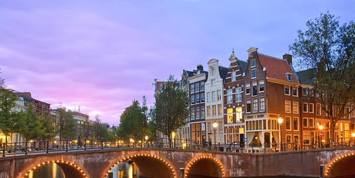 a bridge over a river with buildings on either side of it