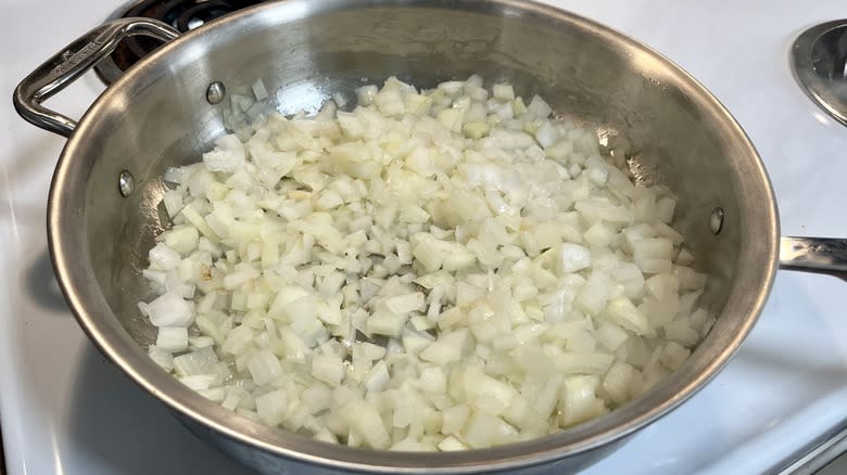 raw onion in frying pan