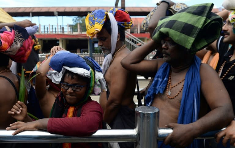 Devotees traditionally carry a ritual offering made of coconuts and clarified butter when they visit the shrine