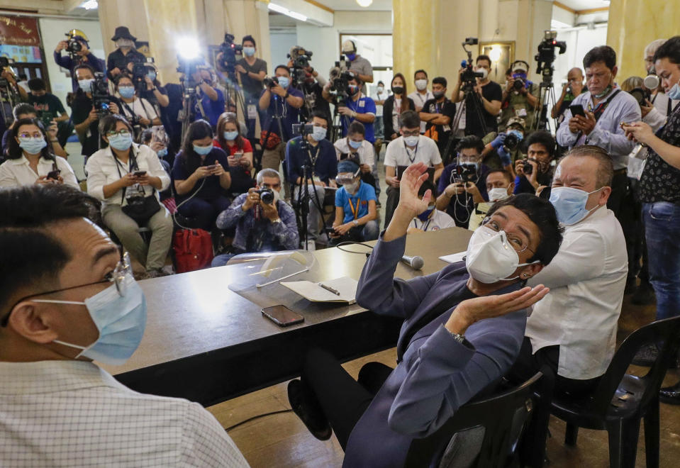 Rappler CEO and Executive Editor Maria Ressa, center, gestures beside former Rappler reporter Reynaldo Santos Jr., left, during a press conference in Manila, Philippines on Monday June 15, 2020. Ressa, an award-winning journalist critical of the Philippine president, her online news site Rappler Inc. and Santos were convicted of libel and sentenced to jail Monday in a decision called a major blow to press freedom in an Asian bastion of democracy. (AP Photo/Aaron Favila)