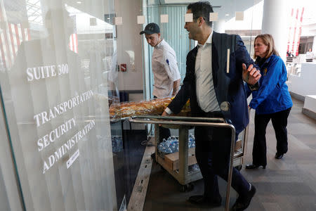 Queens Borough President Melinda Katz and Brad Blumenfeld, Vice President of Blumenfeld Development Group, deliver free lunch to Transportation Security Administration (TSA) employees working without pay during the partial government shutdown at the TSA offices inside the Bulova Corporate Center in the Queens borough of New York City, New York, U.S., January 22, 2019. REUTERS/Mike Segar