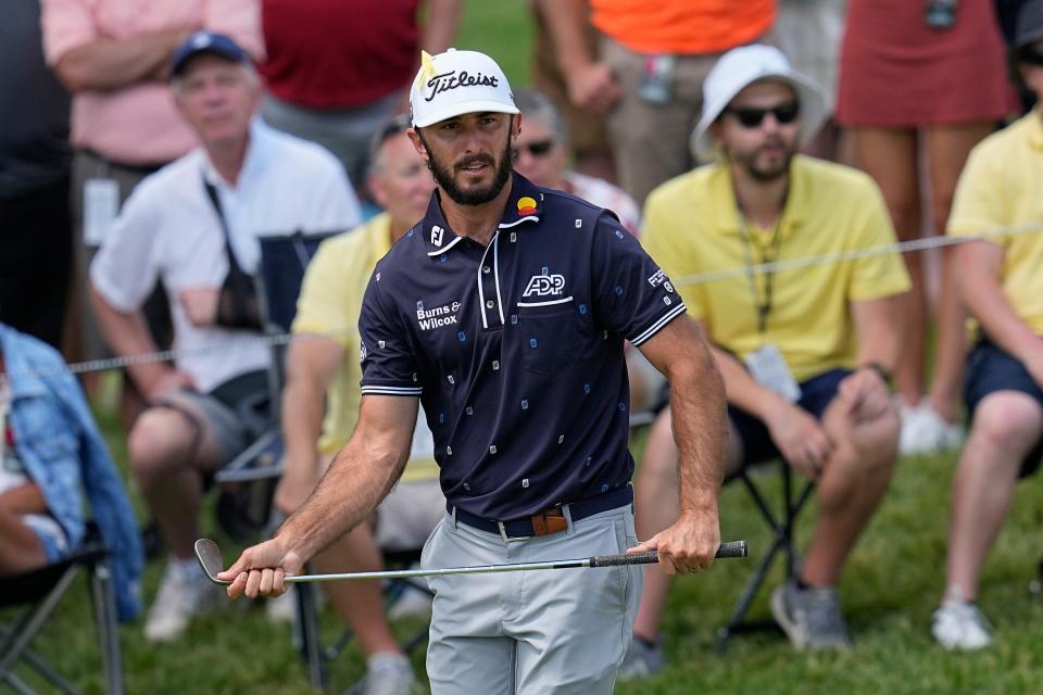 Max Homa watches his chip onto the 17th green during the final round of the Memorial golf tournament Sunday, June 5, 2022, in Dublin, Ohio. (AP Photo/Darron Cummings)