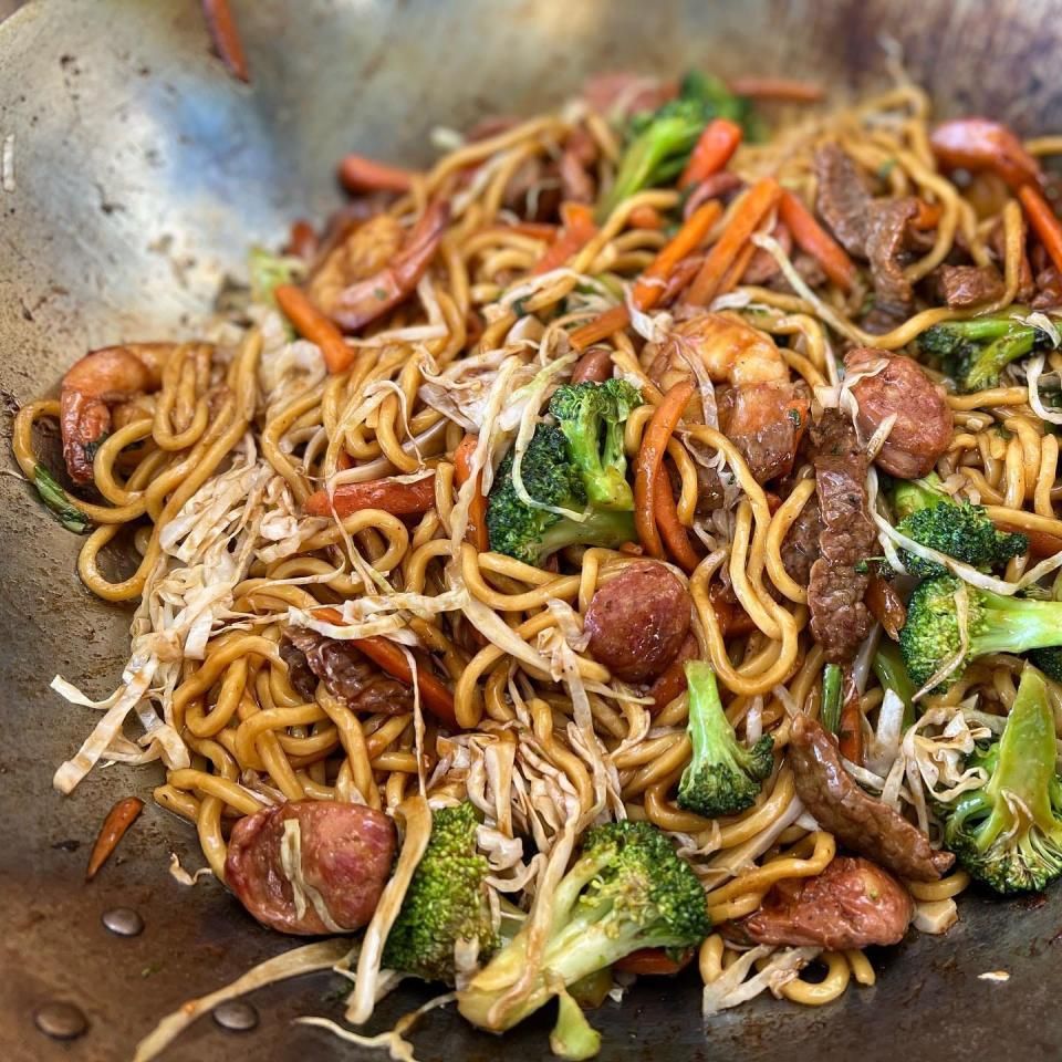 Hot in the wok at La Cajita China ghost kitchen and delivery service: chorizo, churrasco and shrimp lo mein.