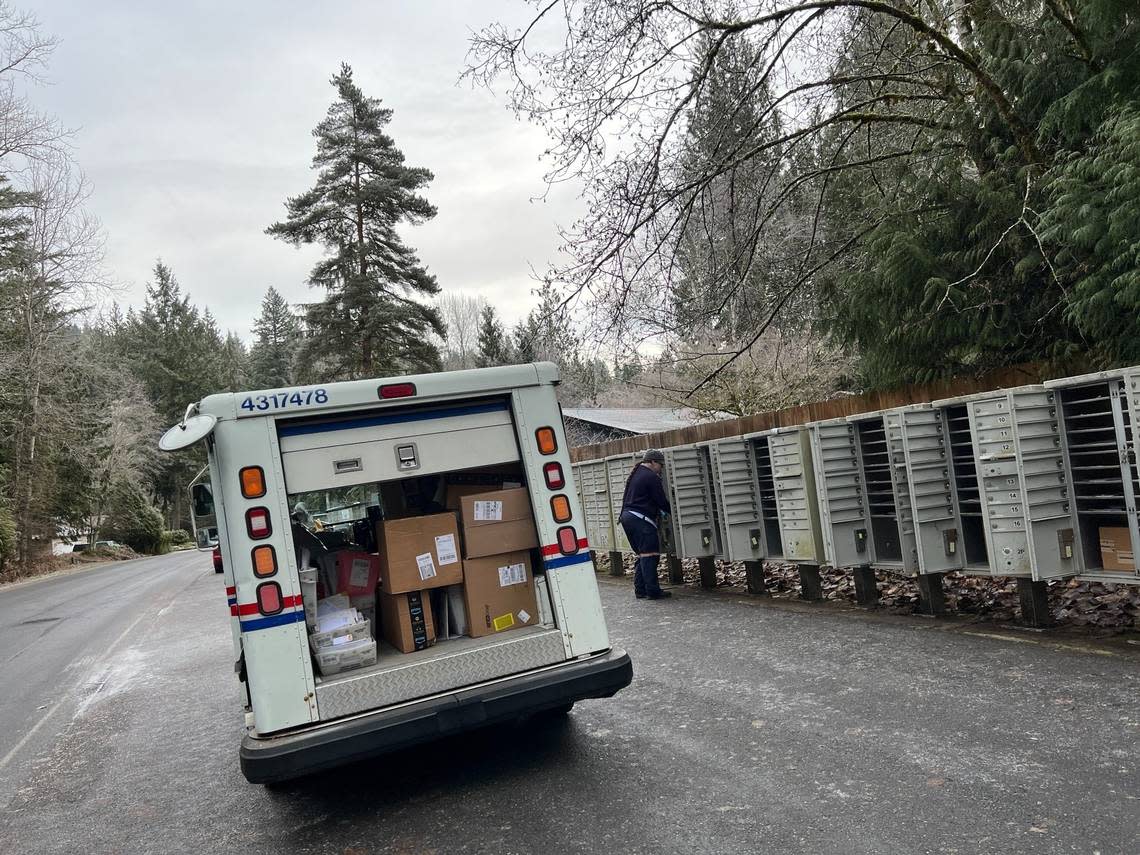 A postal carrier delivers packages to residents at Sudden Valley Gate 13 east of Bellingham in 2022. Whatcom County’s representative in Congress is still seeking answers about slow mail delivery from Louis DeJoy, head of the U.S. Postal Service.