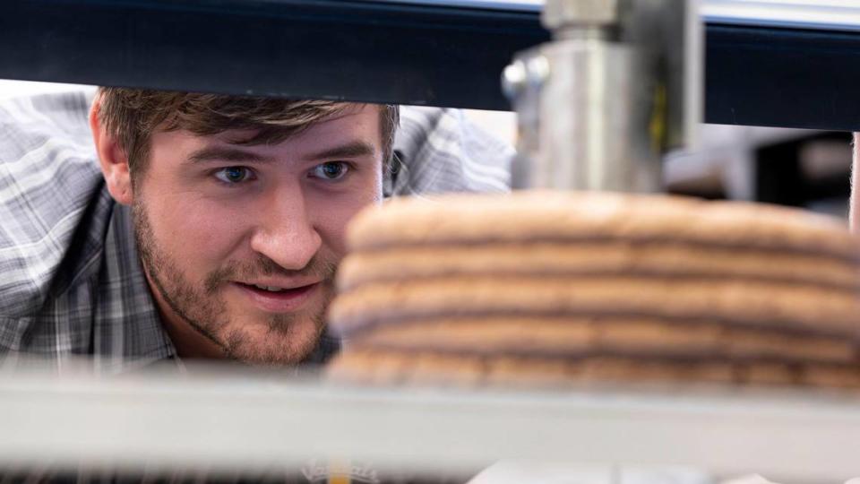 Robert Carne, a Ph.D. student in Mechanical Engineering at University of Idaho, 3-D prints a part that could represent a wall section for a house.
