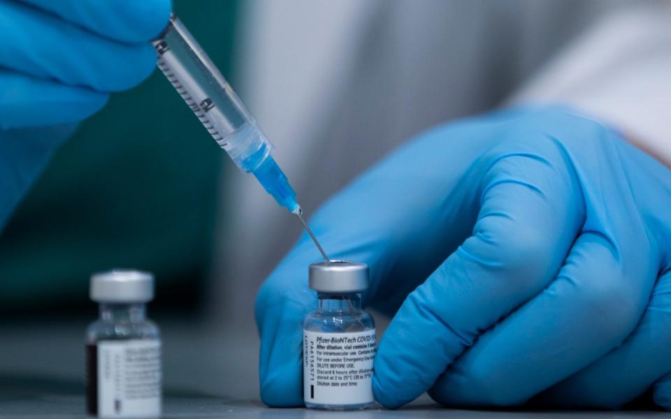 A health care professional prepares a Pfizer-BioNTech COVID-19 vaccine at Sheba Tel Hashomer Hospital in Ramat Gan - AP/AP