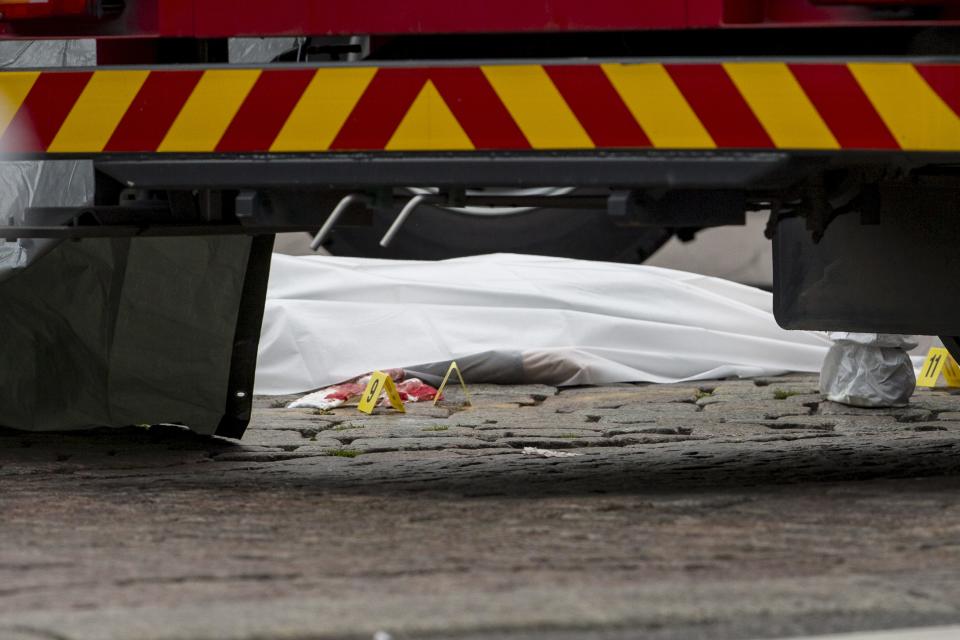 <p>Rescue personnel have covered a stabbing victim’s body at the Turku Market Square in the Finnish city of Turku where several people were stabbed on Aug. 18, 2017. (Roni Lehti/AFP/Getty Images) </p>