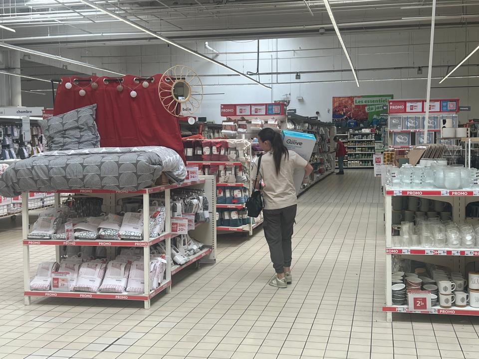 Aisles of home goods and other items at Auchan