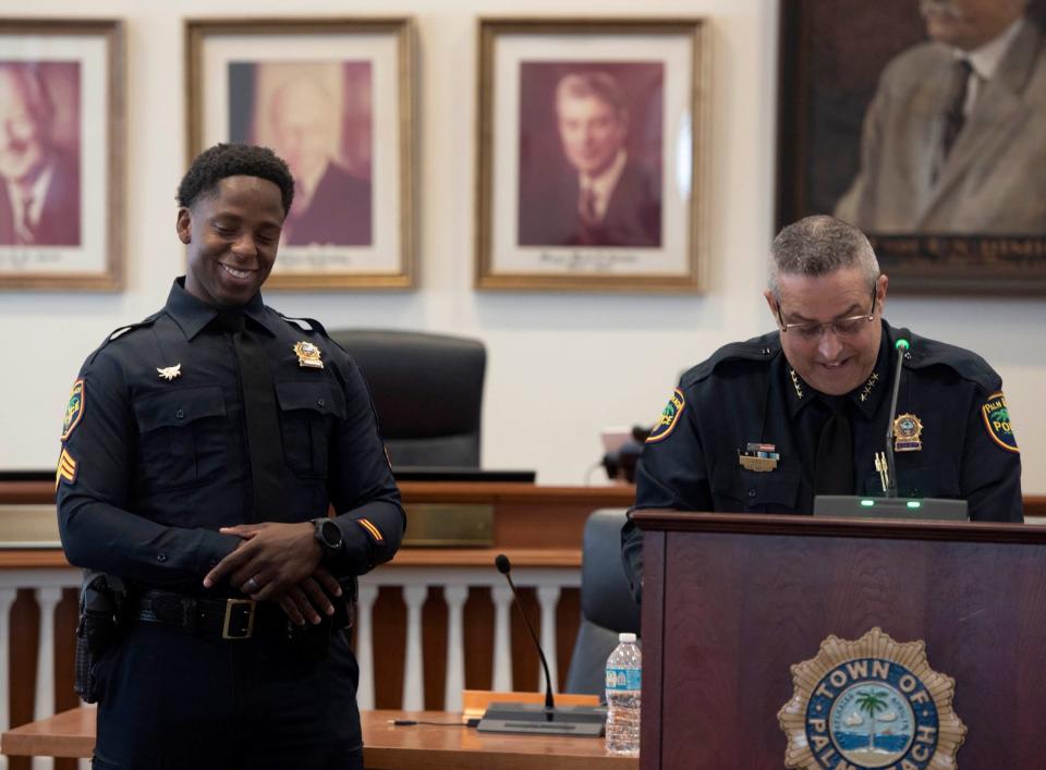 Palm Beach Police Sgt. Anducchi Augustin smiles as police Chief Nicholas Caristo announces his promotion Friday.