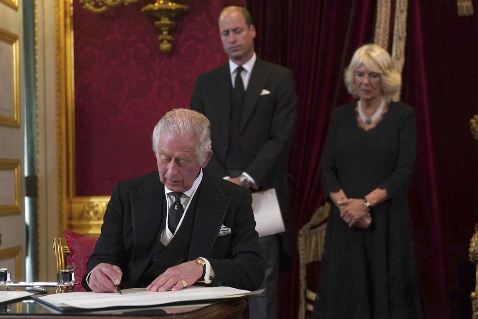 King Charles III signs an oath to uphold the security of the Church in Scotland during the Accession Council at St James's Palace