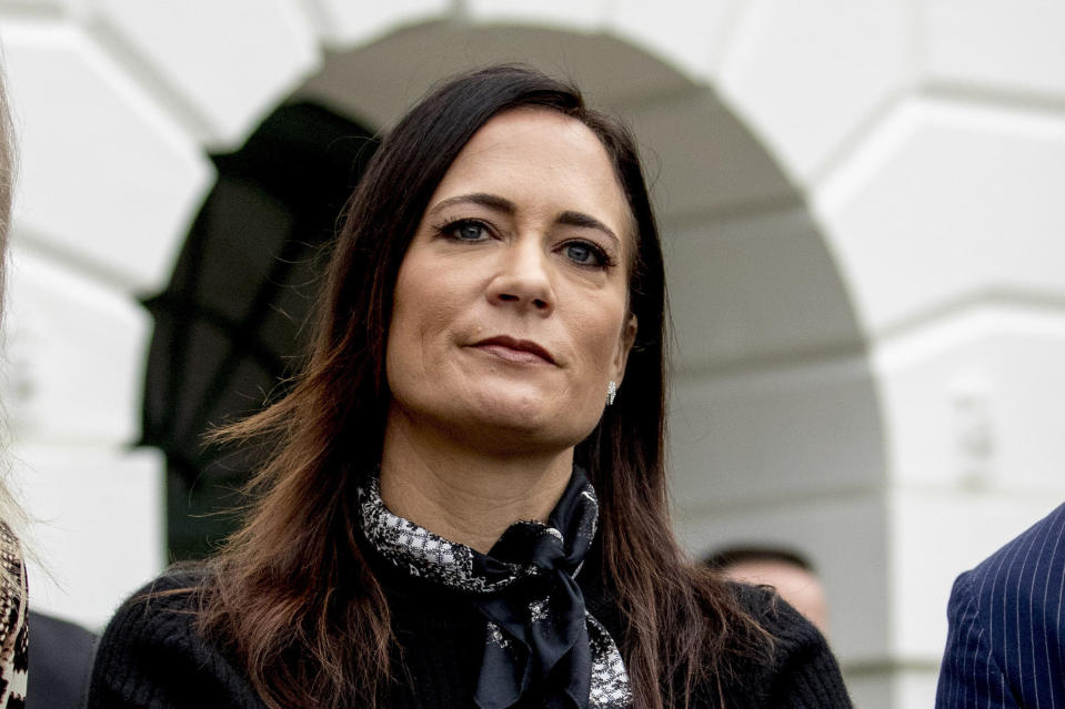 FILE - In this Oct. 3, 2019, file photo, then White House press secretary Stephanie Grisham listens as President Donald Trump speaks to the media on the South Lawn of the White House in Washington. Republican Max Miller, a candidate for Ohio's 16th House District, filed a defamation lawsuit against Grisham in a court in Cleveland on Tuesday, Oct. 5, 2021, over allegations of physical abuse Grisham is leveling while promoting her new book, "I'll Take Your Questions Now: What I Saw at the Trump White House." (AP Photo/Andrew Harnik, File)