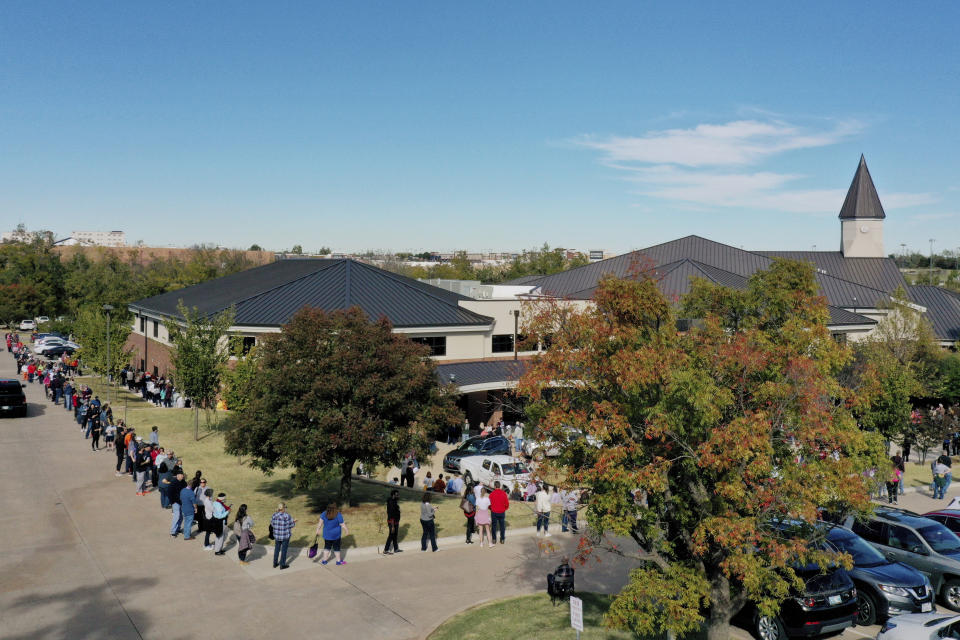 FILE - In this Friday, Oct. 30, 2020, file photo, a line for early voting at a polling place in Oklahoma County wraps around Edmond Church of Christ in Edmond, Okla. Oklahoma is making voting slightly easier, a contrast to other Republican-led states. Republican Gov. Kevin Stitt recently signed a bill that adds a day of early voting and makes changes to ensure mail-in ballots are received in time to be counted. (AP Photo/Sue Ogrocki)