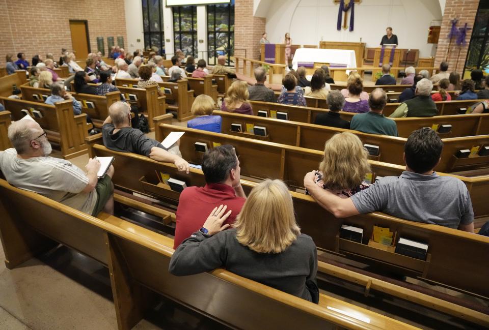 Guests listen to Doug Ferg, a teacher, talk about his experience with teen suicide during a civic academy on youth mental health in Chandler on March 13, 2023.