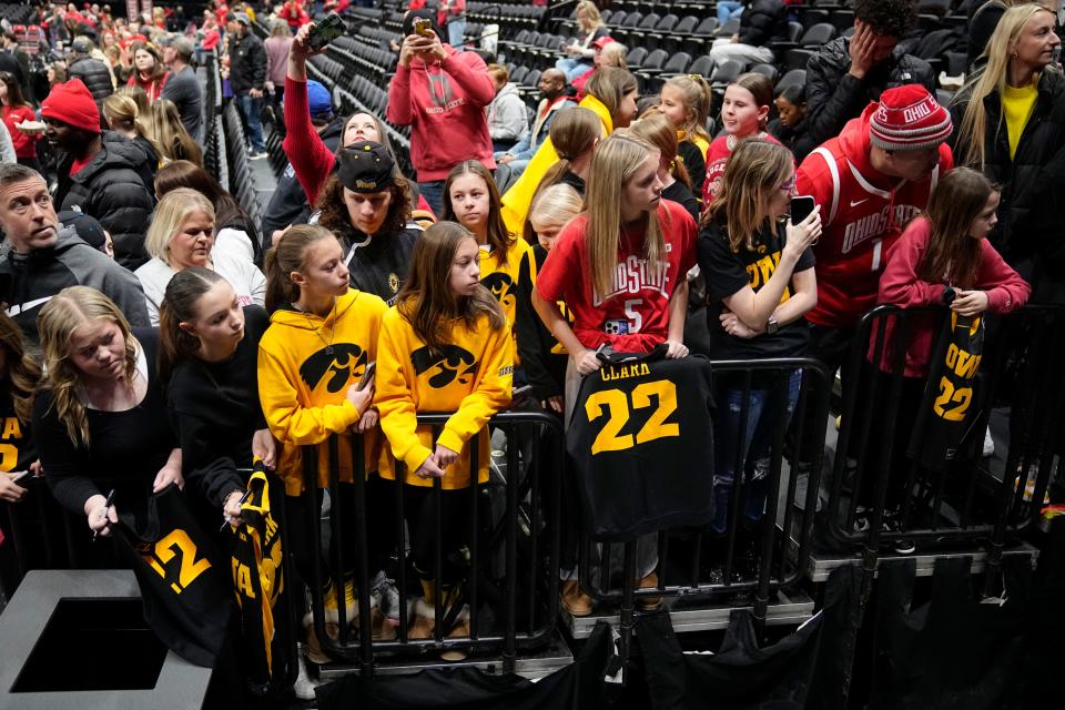 Fans line up to watch Iowa guard Caitlin Clark take the court prior to her game against Ohio State at Value City Arena on Sunday.
