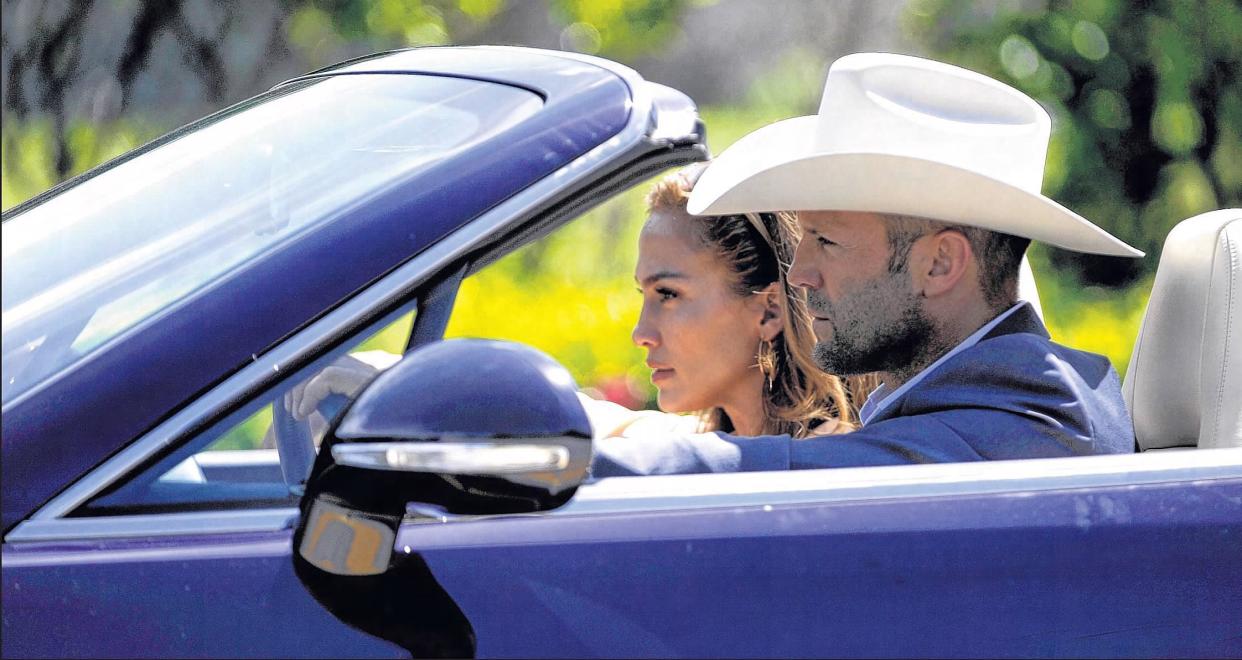Jason Statham  and Jennifer Lopez on South Ocean Boulevard during the filming of "Parker" in September 2011.