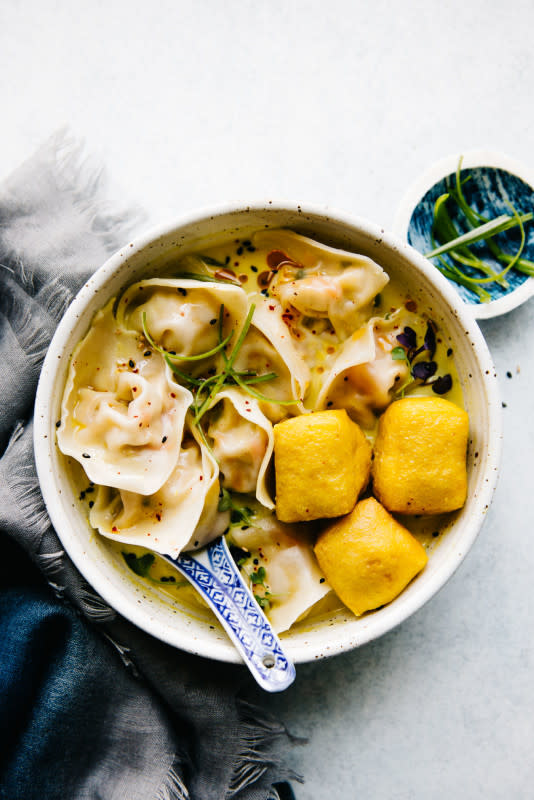 <p>Healthy Nibbles and Bits</p><p>Making dumplings is so therapeutic. Here’s a simple recipe for a delicious yellow curry wonton soup that is vegetarian. It’s one of my favorite dumpling and broth combinations!</p><p><strong>Get the recipe: <a href="https://healthynibblesandbits.com/tofu-wontons-yellow-curry-broth/" rel="nofollow noopener" target="_blank" data-ylk="slk:Tofu Wontons with Yellow Curry Broth;elm:context_link;itc:0;sec:content-canvas" class="link rapid-noclick-resp"><em>Tofu Wontons with Yellow Curry Broth</em></a></strong></p>