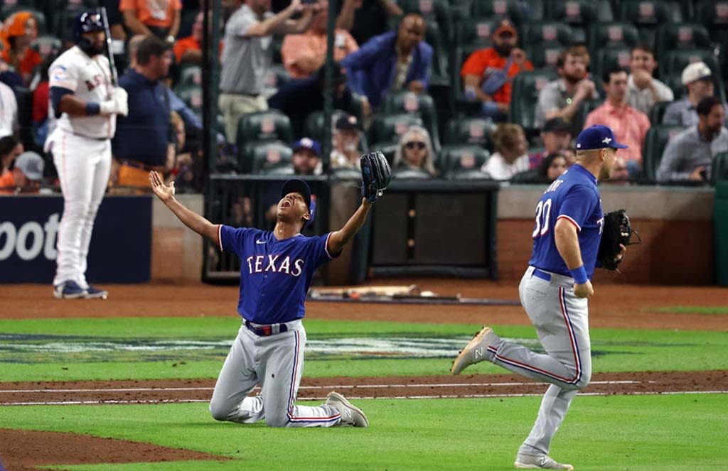  Jose Leclerc #25 of the Texas Rangers celebrates the final out to defeat the Houston Astros in Game Seven to win the American League Championship Series at Minute Maid Park on October 23, 2023. 