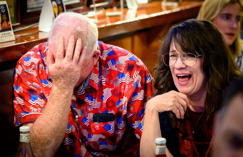 Patrons react during a watch party for the first presidential debate of the 2024 presidential elections between US President Joe Biden and former US President and Republican presidential candidate Donald Trump at a pub in San Francisco, California, on June 27, 2024. The presidential debate is taking place in Atlanta, Georgia. (Photo by JOSH EDELSON / AFP) (Photo by JOSH EDELSON/AFP via Getty Images)