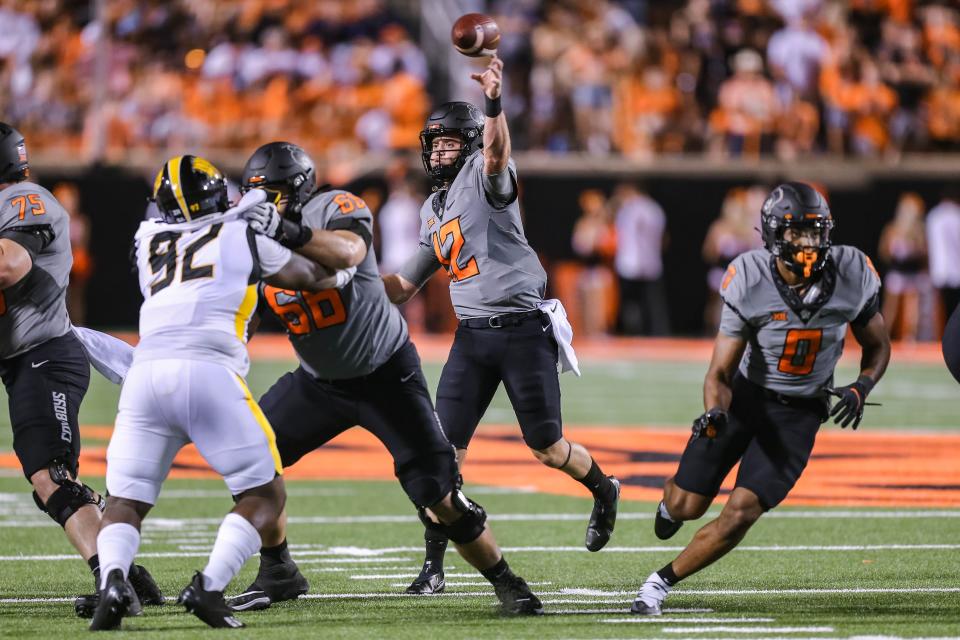 Oklahoma State redshirt freshman Gunnar Gundy (12) threw two touchdown passes on Saturday night, the first of his OSU career.