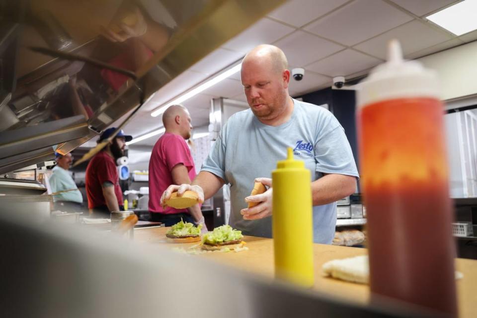 Mike McLemore prepares hamburgers at Zesto of West Columbia in on Monday, May 20, 2024. The restaurant, which opened in 1949, is celebrating its 75th year.