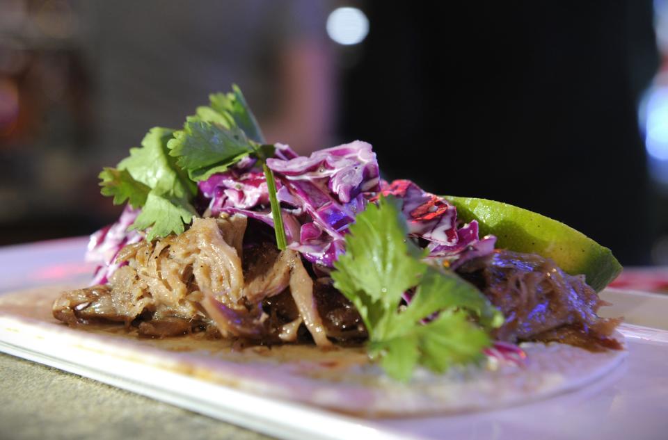 A taco filled with duck confit, red cabbage, goat cheese crema and a sprinkle of cilantro and lime is served at the Lamasco Bar & Grill on Tuesday, Jan. 24, 2024.
