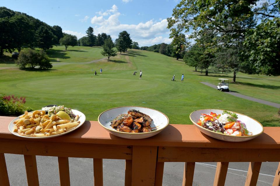 These are some of the weekly dinner specials at The Civic Kitchen and Drink Restaurant, which overlooks the Westborough Country Club, July 13, 2022. From left are the whole belly clam platter; Mediterranean Buddha bowl; and Harvey's honey mustard chicken.