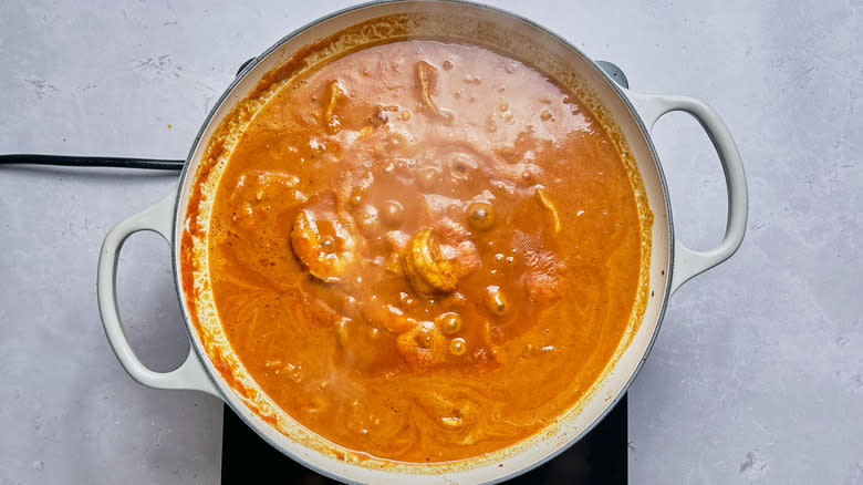 shrimp in curry sauce in skillet