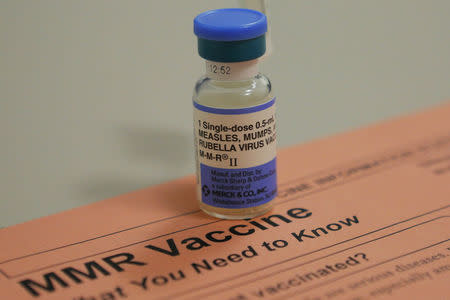 A vial of measles, mumps and rubella vaccine and an information sheet is seen at Boston Children's Hospital in Boston, Massachusetts February 26, 2015. REUTERS/Brian Snyder
