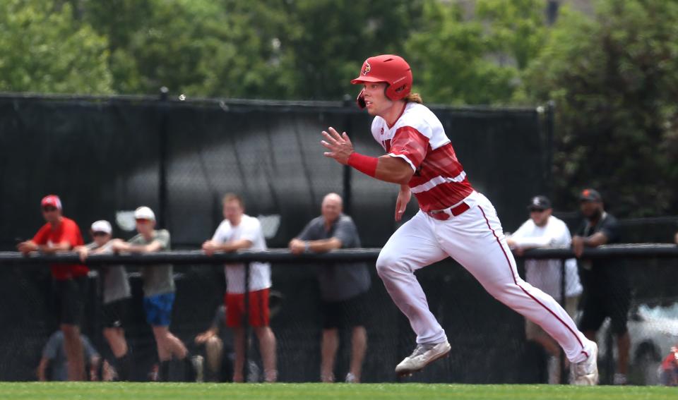 Louisville’s Dalton Rushing goes from 1st to 2nd against Virginia in the last game of the regular season.May 21, 2022