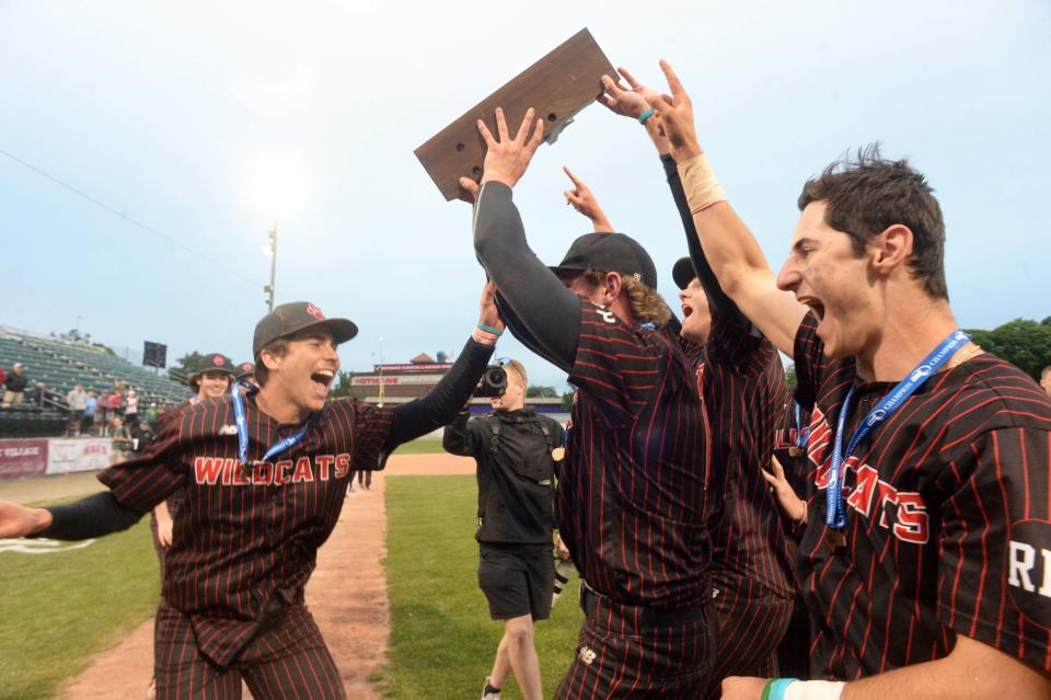 Milton co-captains Charles Walker, center, and catcher Shea Donovan, right, celebrate at the conclusion of their championship game. Milton baseball versus King Philip in the MIAA D2 state championship game at Fitton Field in Worcester on Saturday, June 18, 2022.