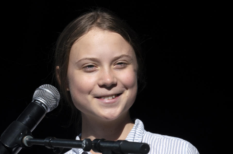 FILE - In this Sept. 27, 2019 file photo, Swedish climate activist and student Greta Thunberg smiles on stage after addressing the Climate Strike in Montreal, Quebec. Thunberg plans to join a climate strike in Denver on Friday, Oct. 11. The event near the state Capitol will include a panel of youth activists and end with a die-in which organizers say will symbolize the millions of people facing danger and death because of climate change. (Paul Chiasson/The Canadian Press via AP, File)