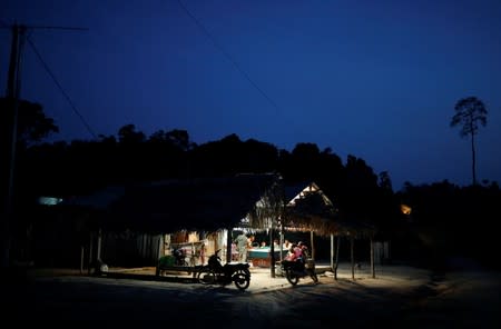 Residents play snooker at a bar in he Virola-Jatoba Sustainable Development Project (PDS) in Anapu