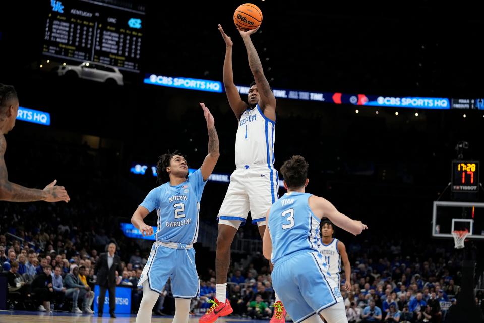 Kentucky guard Justin Edwards shoots over North Carolina guard Elliot Cadeau during the first half. Edwards contributed eight points in the Wildcats' 87-83 victory Saturday night in Atlanta.