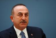 Turkish Foreign Minister Cavusoglu attends a news conference in Riga