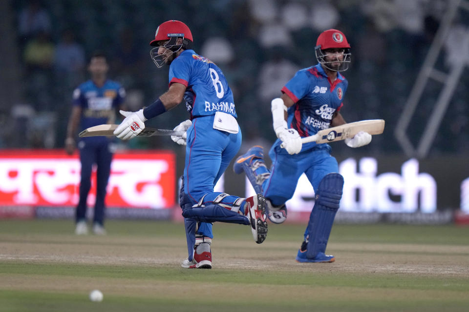 Afghanistan's Hashmatullah Shahidi, right, and Rahmat Shah take a run during the Asia Cup cricket match between Afghanistan and Sri Lanka in Lahore, Pakistan, Tuesday, Sept. 5, 2023. (AP Photo/K.M. Chaudary)