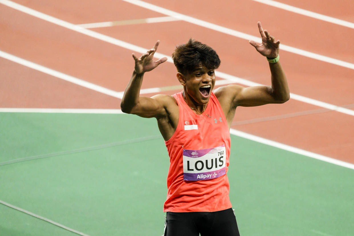 Singapore sprinter Marc Brian Louis is jubilant after setting a national record of 10.27sec in the men's 100m semi-finals at the 2023 Hangzhou Asian Games. (PHOTO: SNOC/Kong Chong Yew)