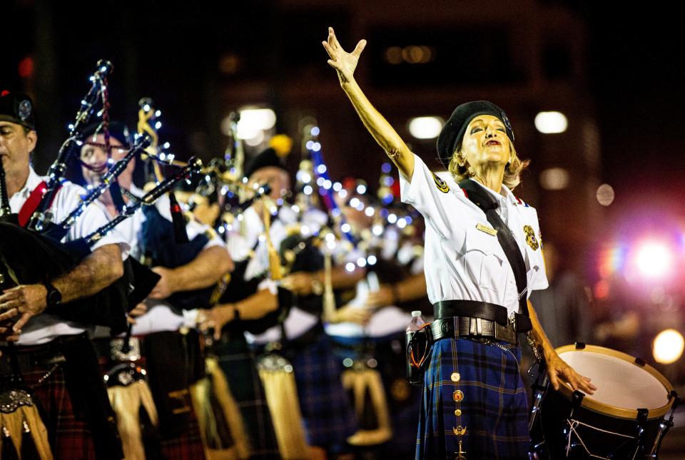 Members Guns and Hoses Pipes and Drums performs during the 2023 Edison Festival of Light Grand Parade in Fort Myers on Saturday, Feb. 18, 2023.  