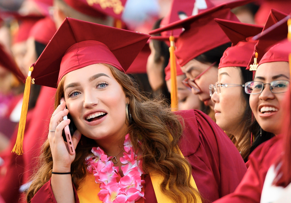 Haley Walters uses her cell phone at the Pasadena City College graduation ceremony, June 14, 2019, in Pasadena, California. (Photo: ROBYN BECK/AFP/Getty Images) 