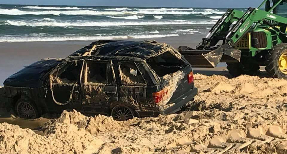 The range rover became bogged on the Fraser Island beach at high tide on Wednesday afternoon. Source: Facebook/I got bogged at Inskip Point