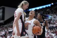 Stanford guard Talana Lepolo, middle, celebrates with forward Cameron Brink, left, after winning possession of the ball and being fouled by South Carolina forward Aliyah Boston during the first half of an NCAA college basketball game in Stanford, Calif., Sunday, Nov. 20, 2022. (AP Photo/Godofredo A. Vásquez)