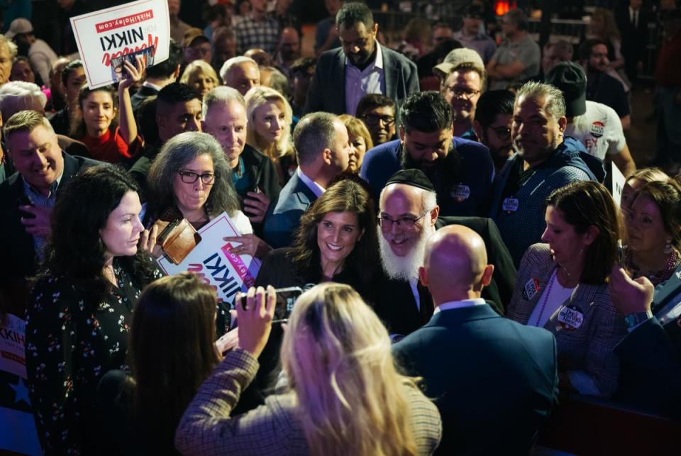 DALLAS, TX - FEBRUARY 15, 2024: Nikki Haley, GOP presidential candidate, poses for photos with supporters at a rally at Gilley’s Dallas South Side Music Hall on Thursday, February 16, 2024, in Dallas, Texas. CREDIT: Desiree Rios for The Texas Tribune