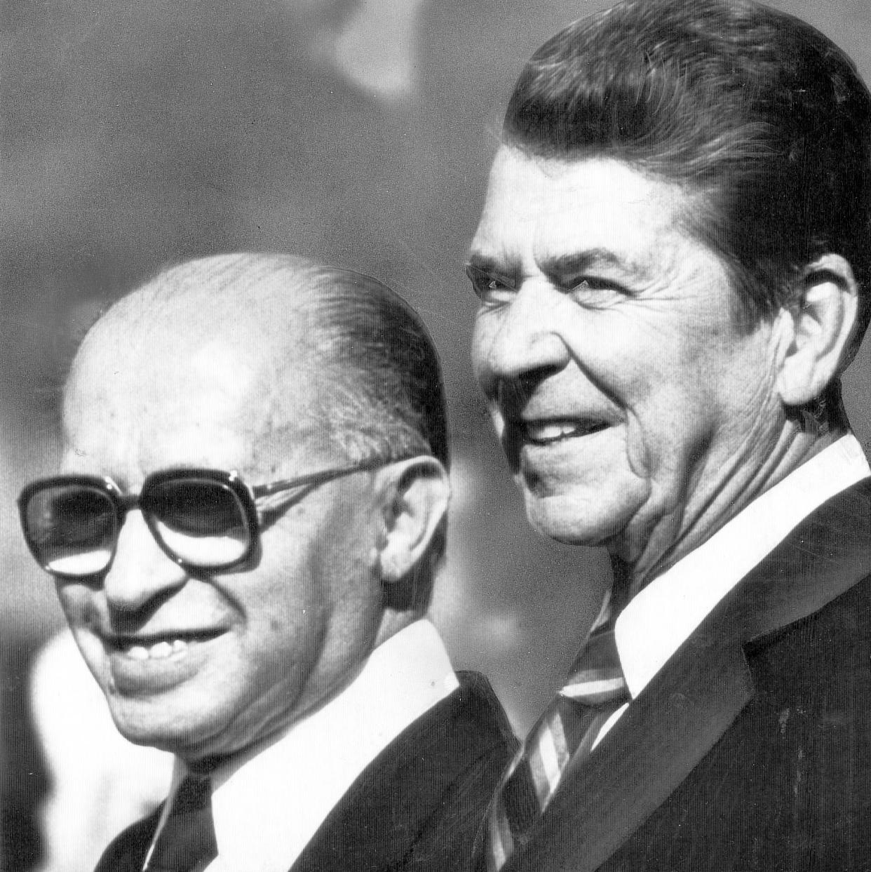Mr Begin and Mr Reagan seen standing together in a black and white shot