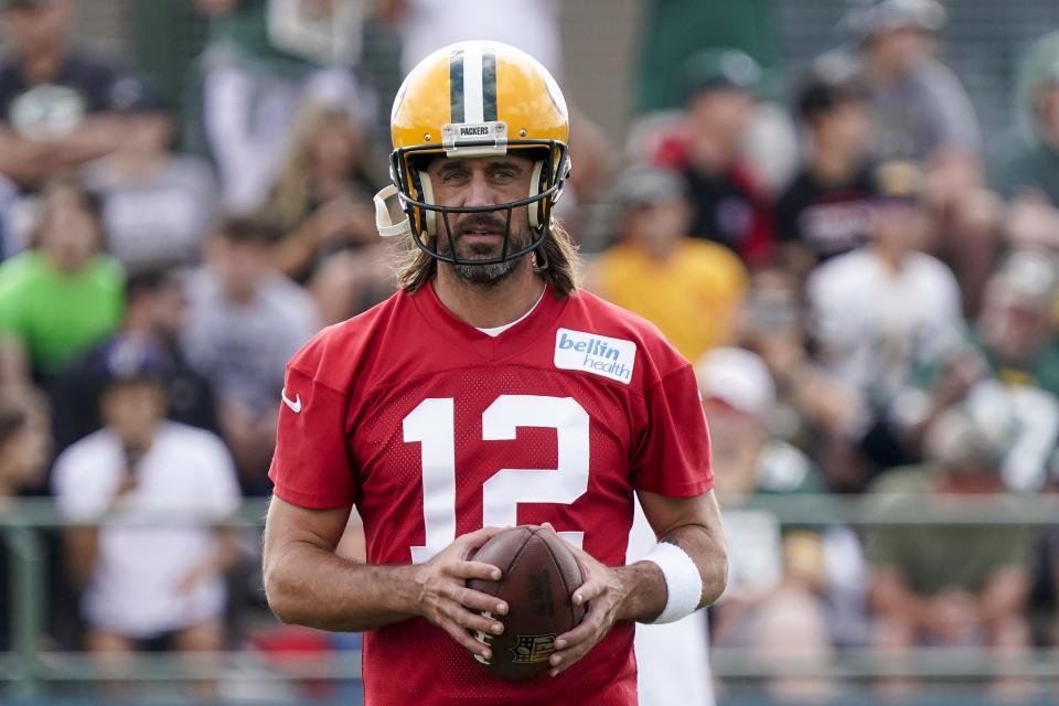 Green Bay Packers' Aaron Rodgers runs a drill at the NFL football team's practice field Wednesday, July 27, 2022, in Green Bay, Wis. (AP Photo/Morry Gash)