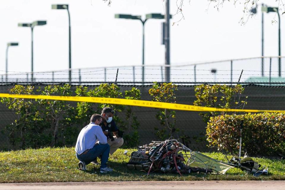 First responders look through debris from an accident scene after a small plane crashed near the 1300 block of Southwest 72nd Avenue in Pembroke Pines, Florida on Monday, March 15, 2021. Two people died in the plane crash and two others were taken to Hollywood’s Memorial Regional Hospital in serious condition, according to city fire-rescue. One of those transferred, a 4-year-old boy, later died.