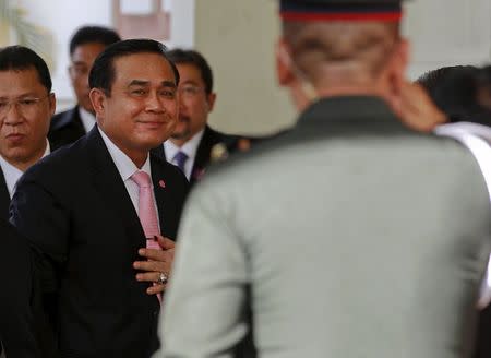 Thailand's Prime Minister Prayuth Chan-ocha smiles as he arrives at the Education Ministry in Bangkok, Thailand, May 21, 2015. REUTERS/Chaiwat Subprasom