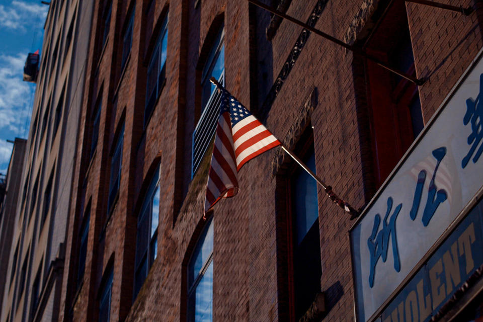 A building in Chinatown with a U.S. flag. (U.S. Department of Transportation)
