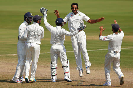 Cricket - India v England - Second Test cricket match - Dr. Y.S. Rajasekhara Reddy ACA-VDCA Cricket Stadium, Visakhapatnam, India - 21/11/16. India's Jayant Yadav (2nd R) celebrates with teammates the dismissal of England's Ben Stokes. REUTERS/Danish Siddiqui