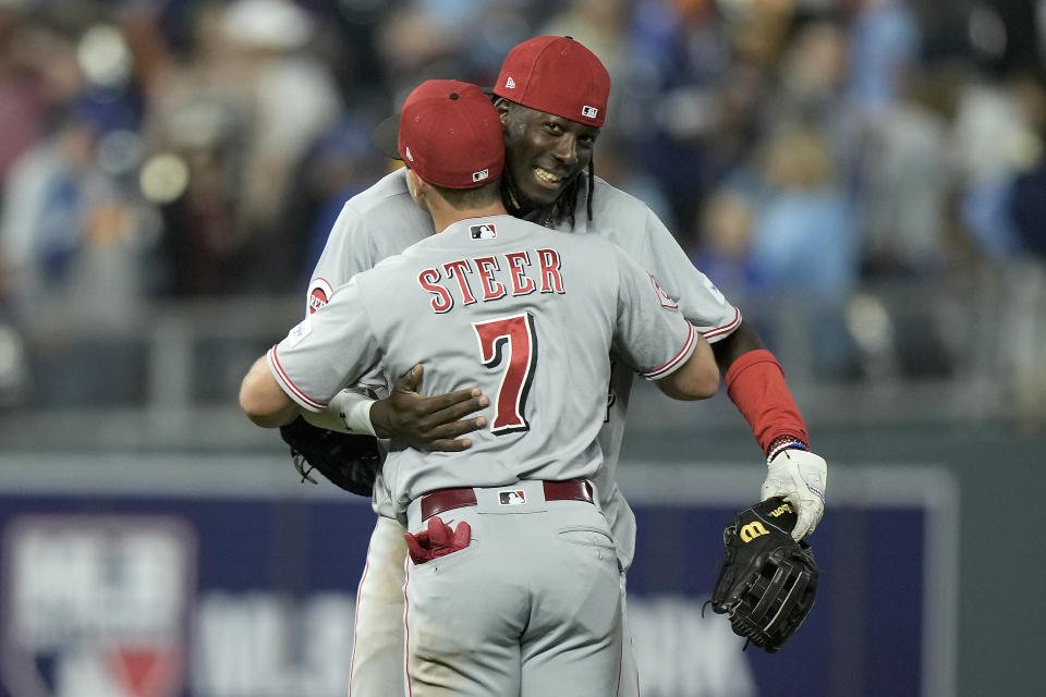 Cincinnati Reds' Elly De La Cruz and Spencer Steer (7) celebrate after their baseball game against the Kansas City Royals Monday, June 12, 2023, in Kansas City, Mo. The Reds won 5-4 in ten innings. (AP Photo/Charlie Riedel)